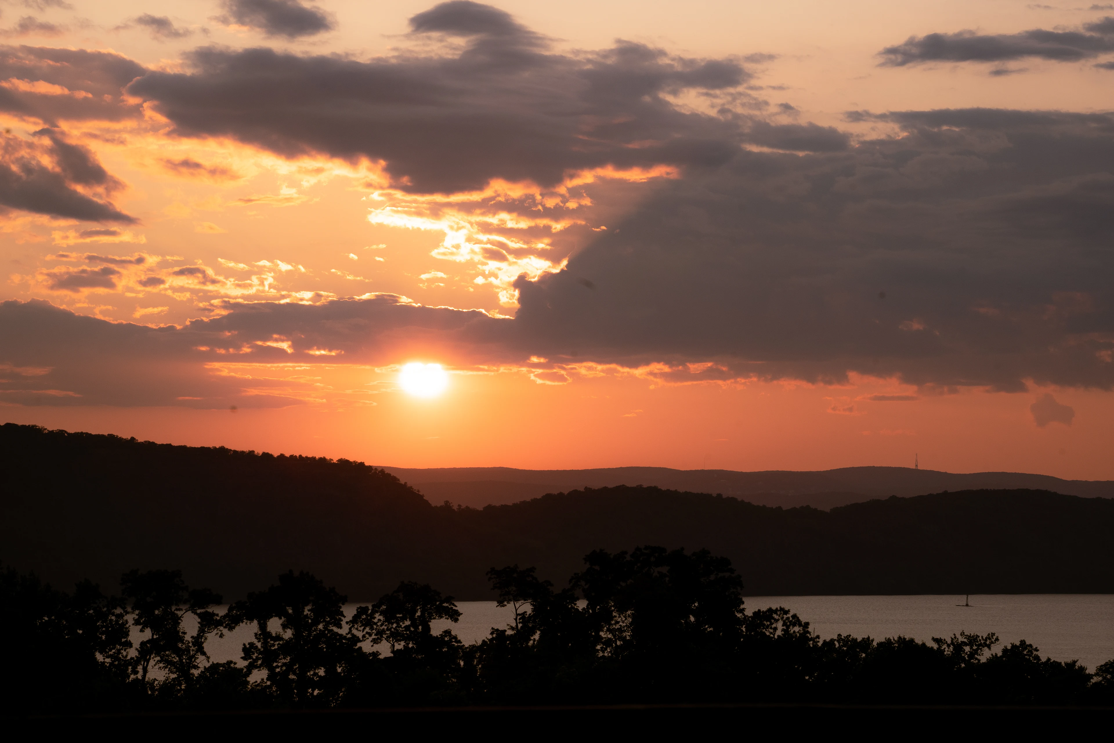 Stone Manor beside the Hudson River at sunset